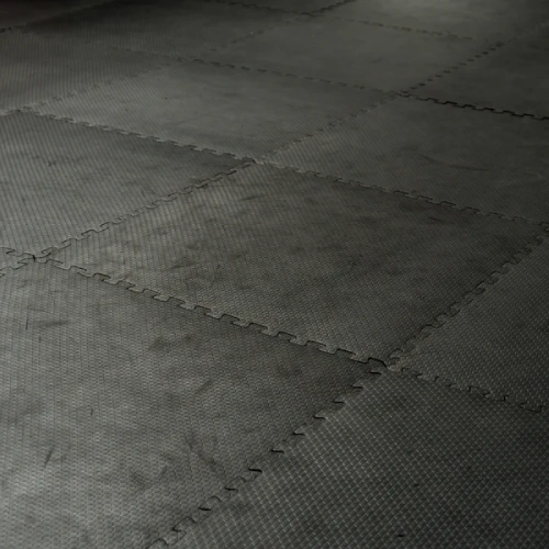 Rubber flooring black square tiles laid in pattern